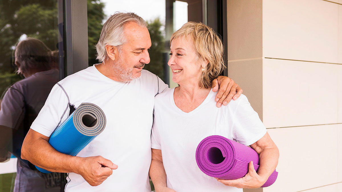 Healthy couple going to yoga.